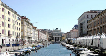 Trieste's Canal Grande with boats and the church of Sant'Antonio Nuovo