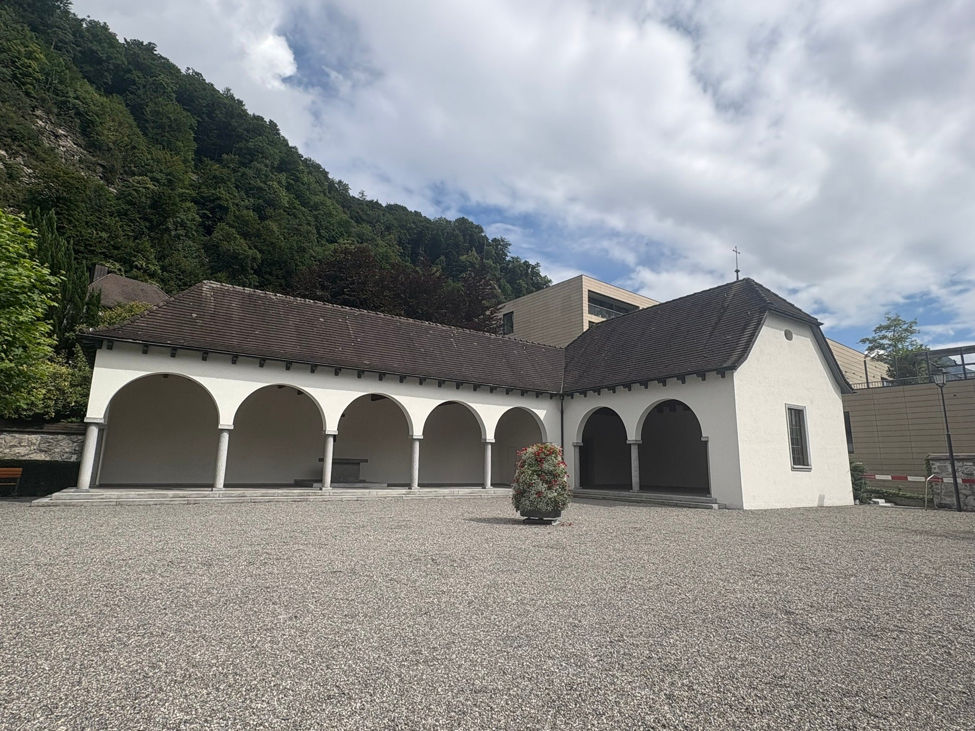 Whitewashed chapel with an arcade at the foot of the castle hill in Vaduz