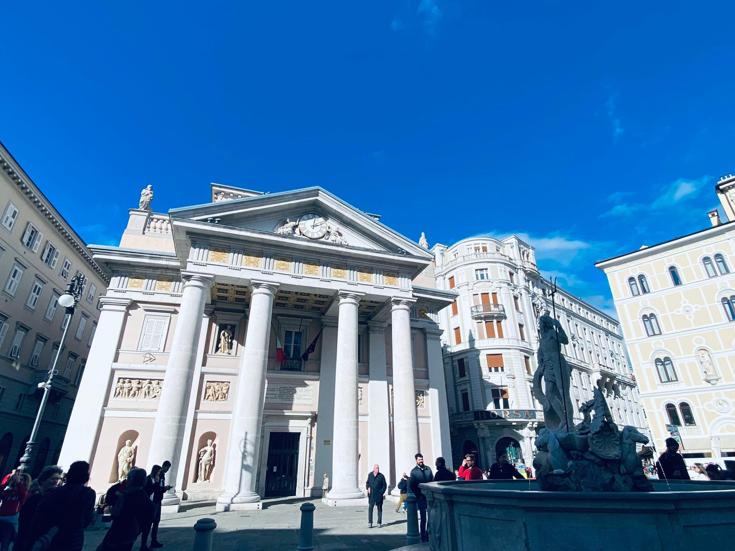 Piazza della Borsa in Trieste with the neoclassical Borsa Vecchia and Neptune Fountain