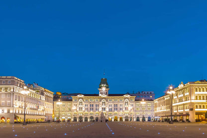 Piazza Unità d'Italia in Trieste at blue hour with the illuminated town hall