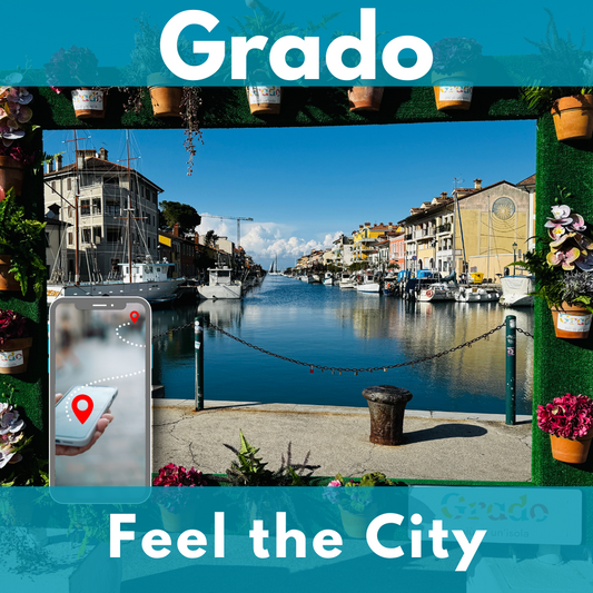 View through a flower-framed arch onto Grado's canal with boats and colourful houses. In the foreground on the left a smartphone showing a route between two red points.