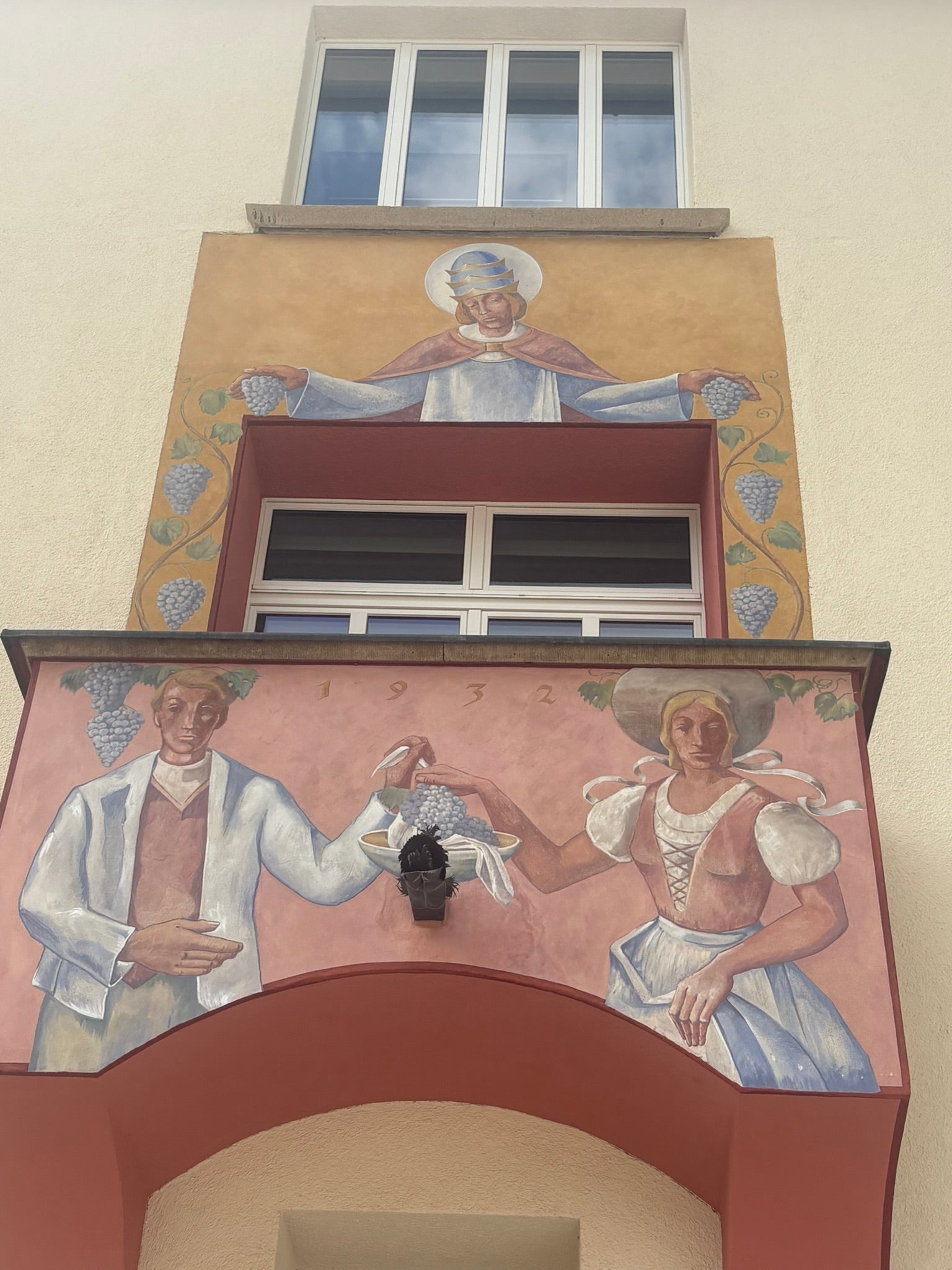 Historic wall fresco with a wine-growing motif on a house facade in Vaduz